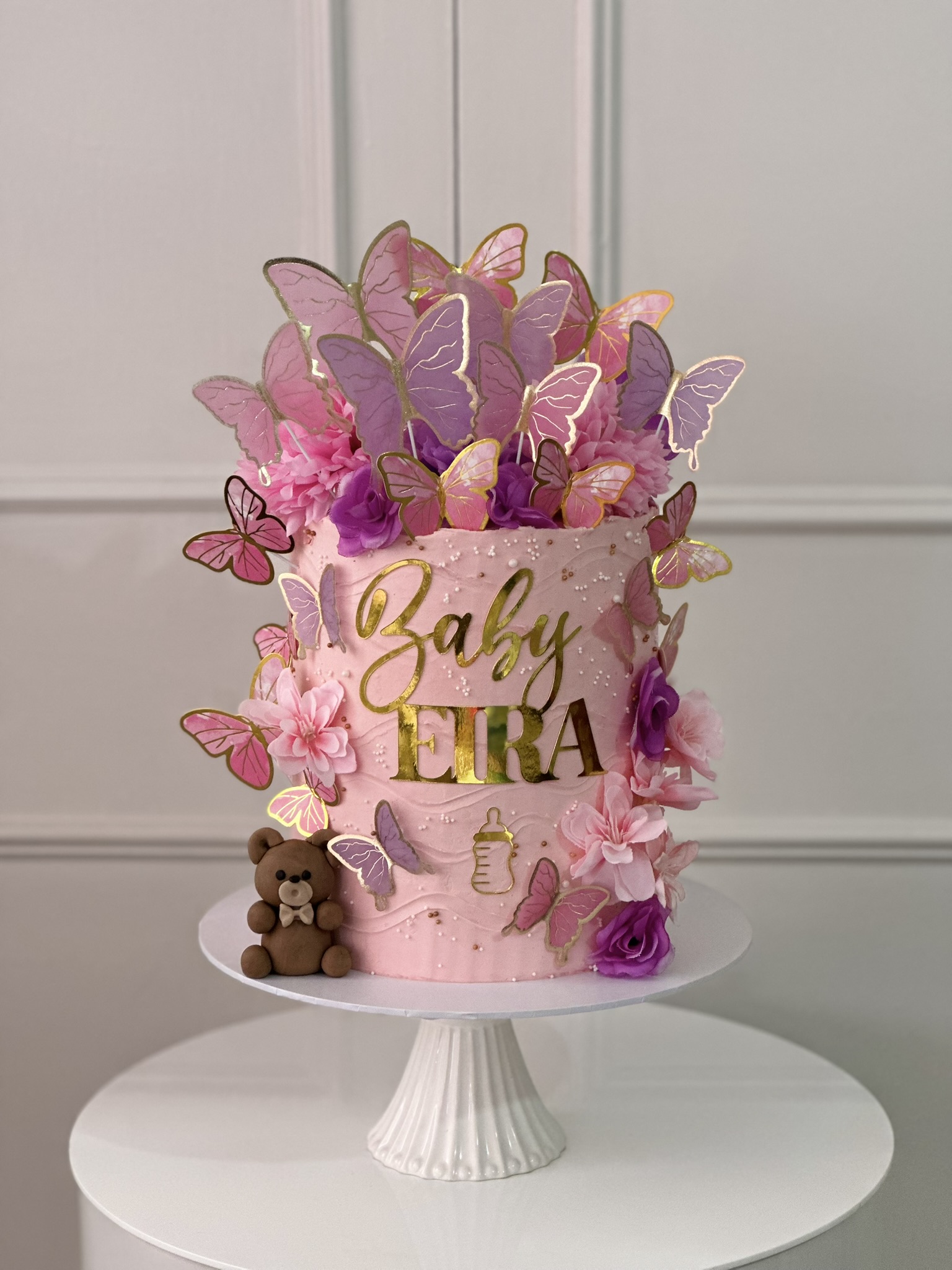 Baby Eira baby shower cake with pink butterflies