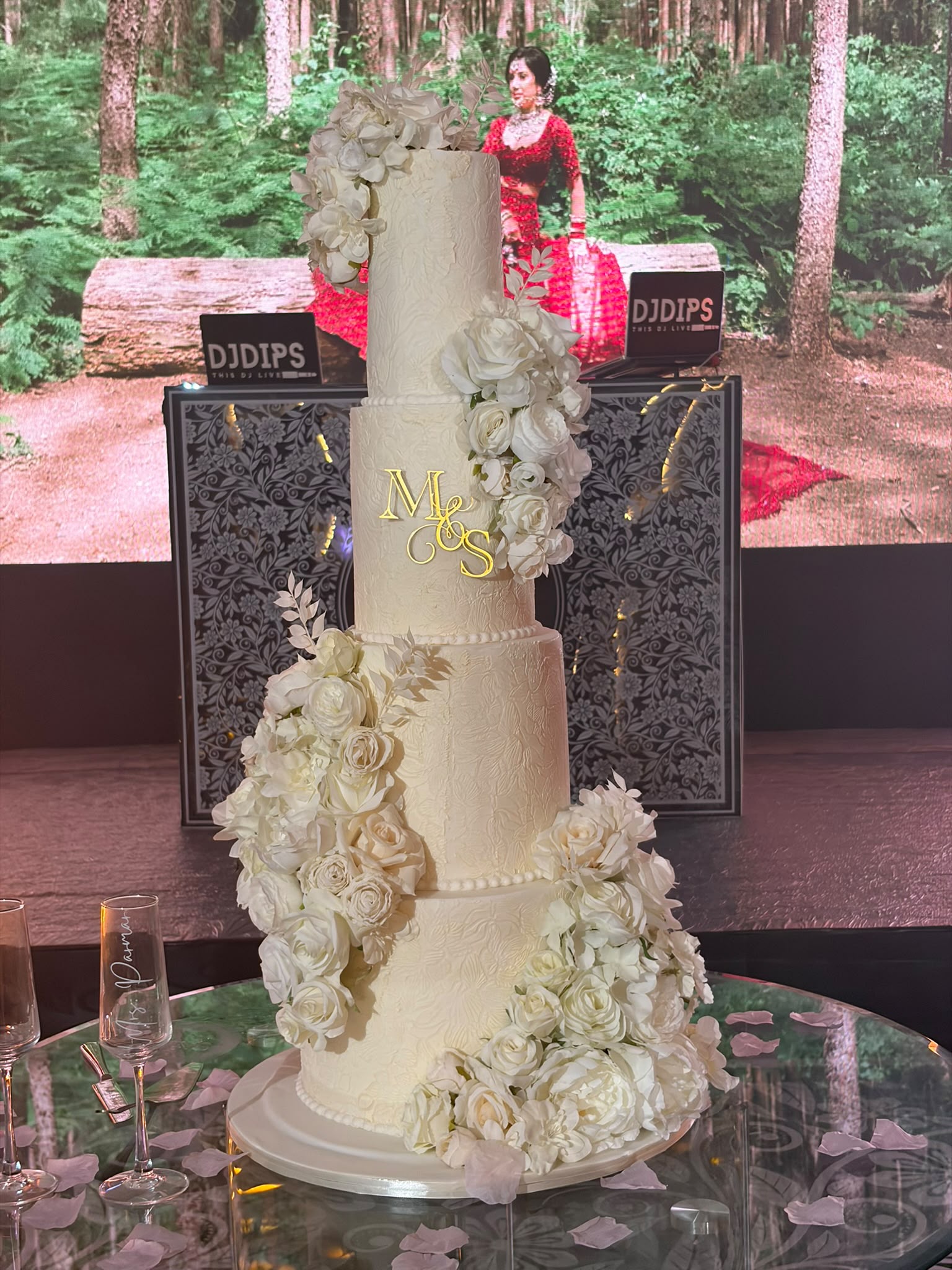 Wedding cake with red roses cascade