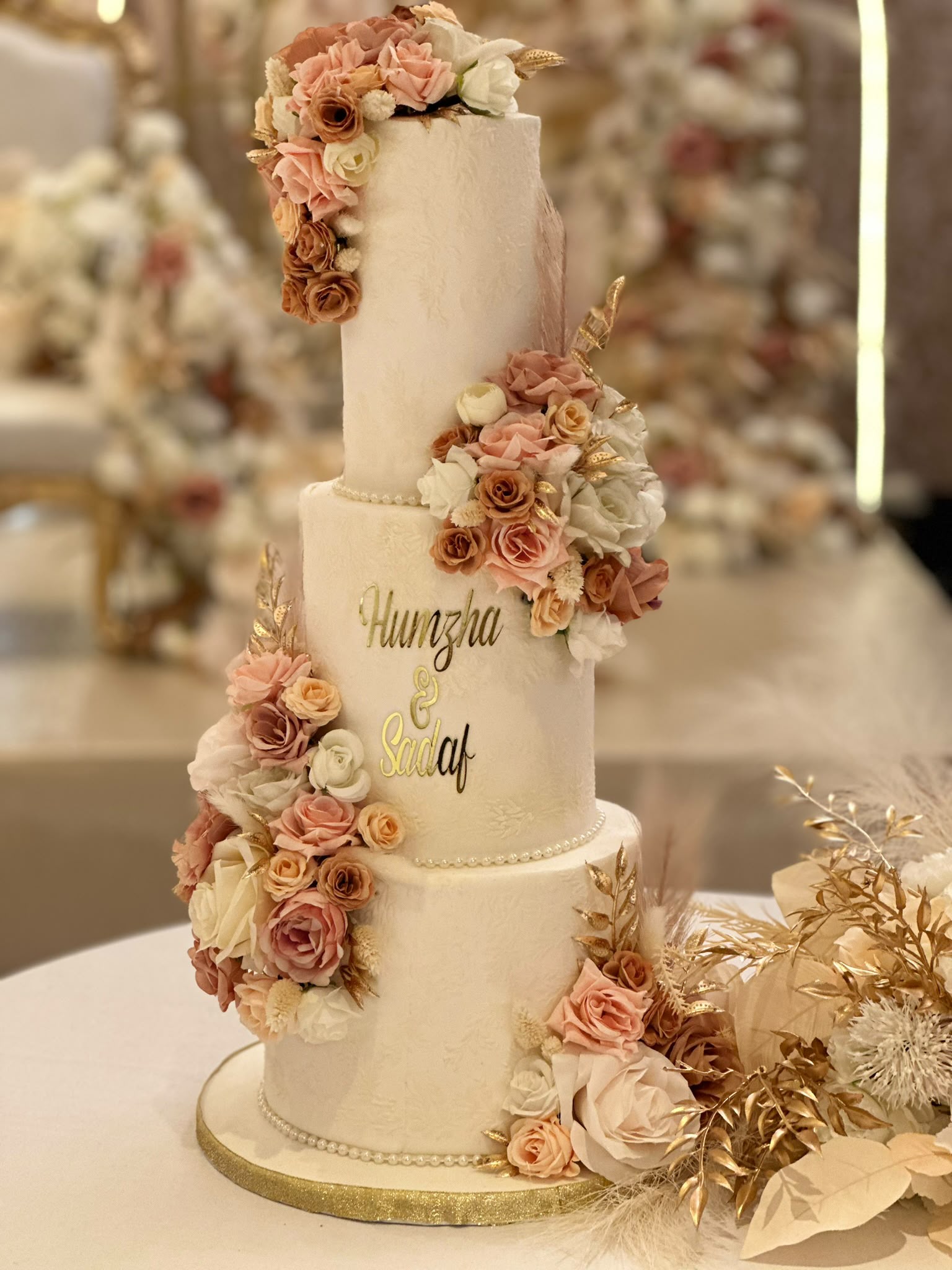Floating tier wedding cake with red roses