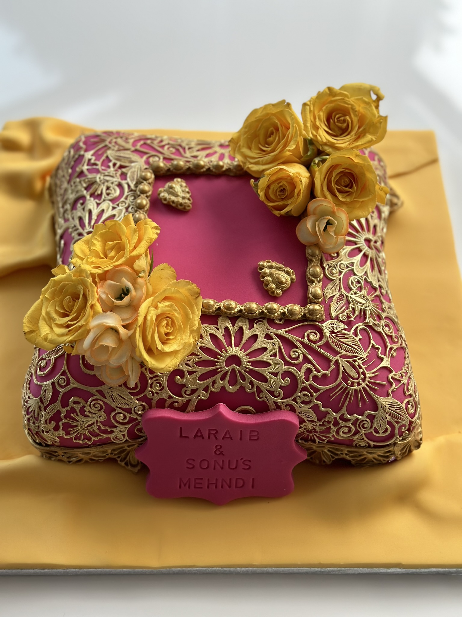 Laraib and Sonu mehndi cushion cake in pink and gold