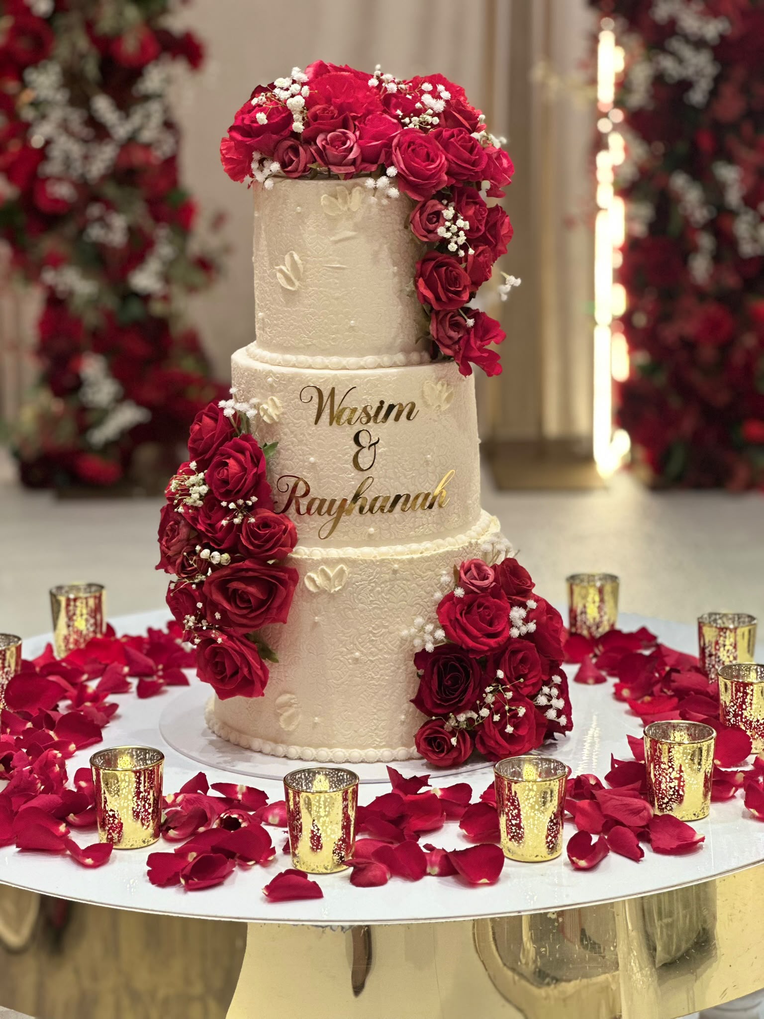 Wasim and Rayhanah wedding cake with red roses